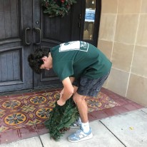 Henry Satel preparing wreath to adorn Olmos Park City Hall entrance