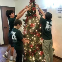 Pictured L-R Henry Satel, Miles Mazloum and brother, Bryce Mazloum decorating Olmos Park's Christmas Tree with new ornaments