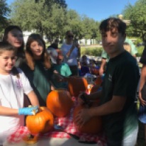 Nina Davidson, Emory Middleman, Ava Greenberg and Jack Henry Bullock help (and have fun!) at October pumpkin carving